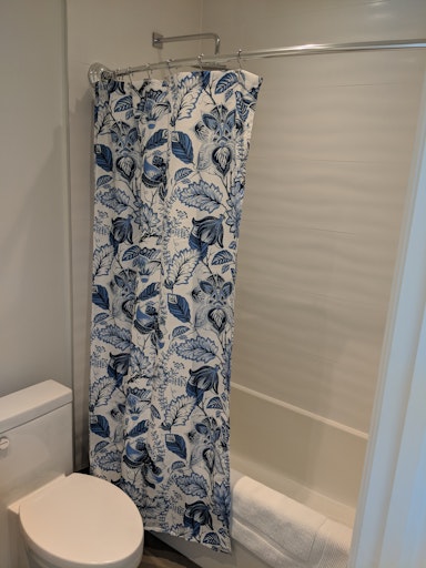 Shower curtain rods and fixtures