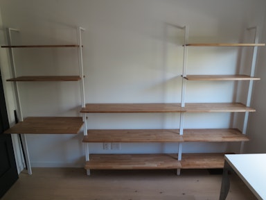 Shelving systems; anchored