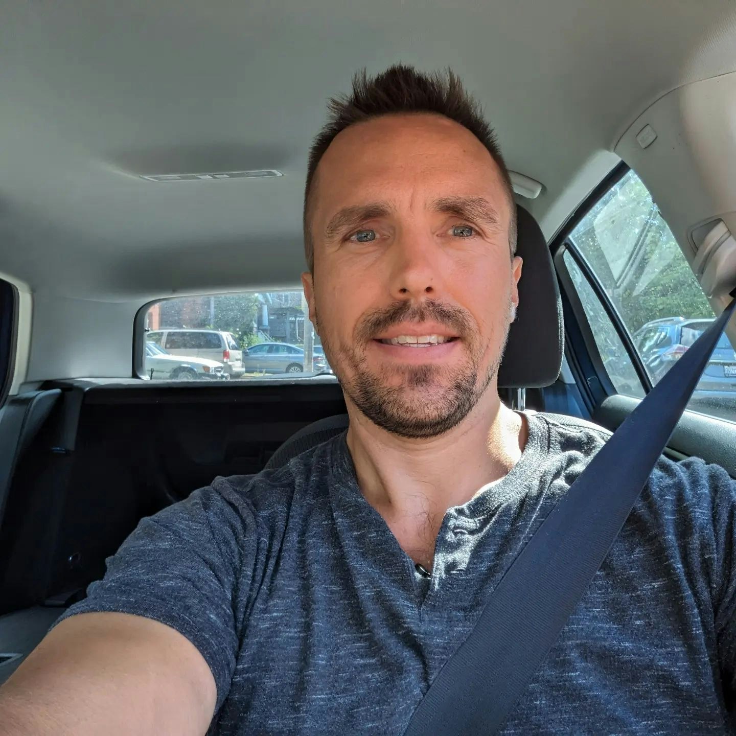 Photo of Kal driving a car and not crashing